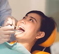 Teen girl receiving dental treatment